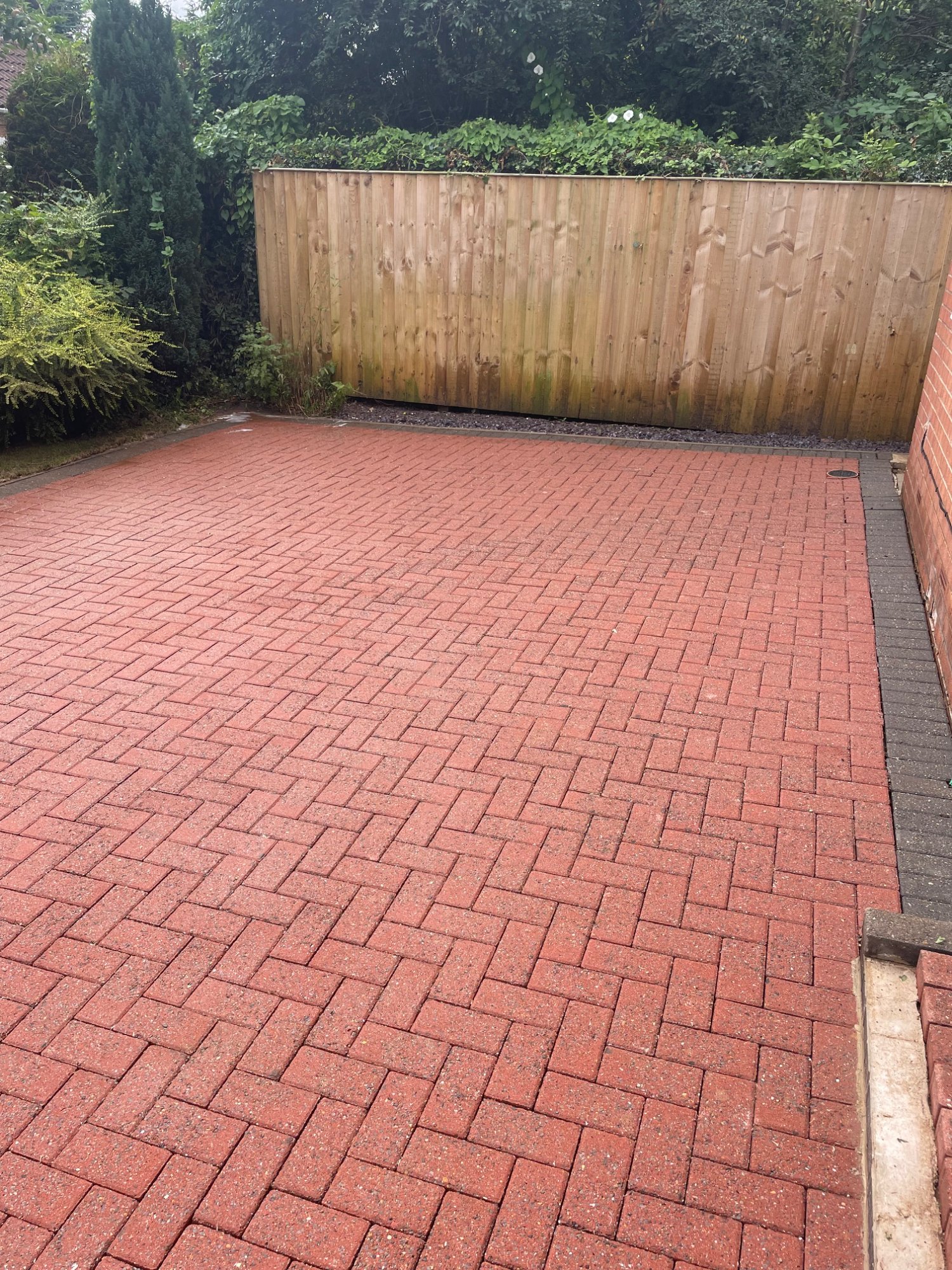 Block paving driveway after professional pressure washing York — fully restored clean red bricks
